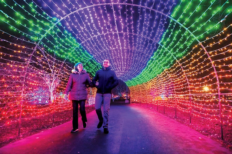 People walking through tunnel at Franklin Park Conservatory