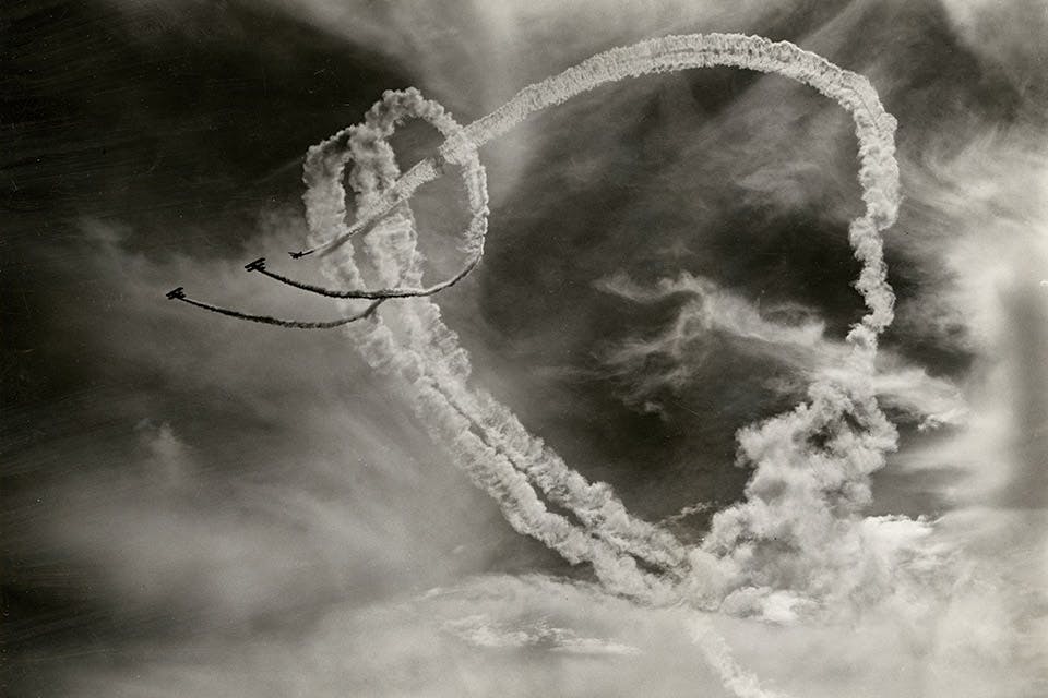 Mike Murphy and his skywriters thread the needle at the 1938 National Air Races Mike Murphy and his skywriters thread the needle at the 1938 National Air Races