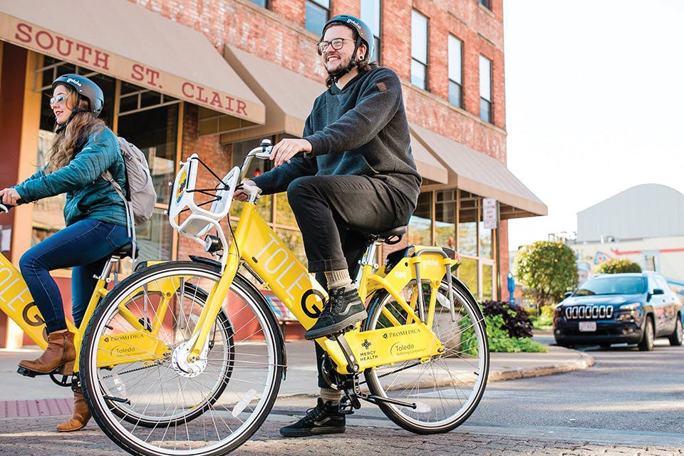 People on ToleGo bike share bikes (photo by Amanda Ranee Photography)
