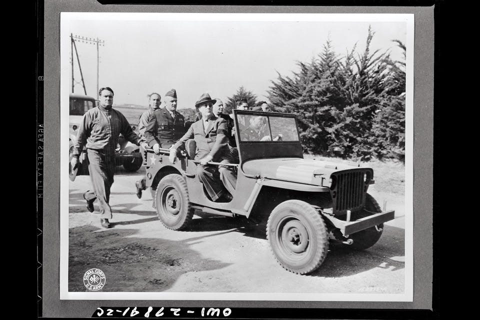 President Franklin D. Roosevelt reviewing forces from jeep