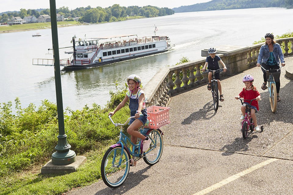 Family biking by the Valley Gem sternwheeler (photo by Casey Rearick)
