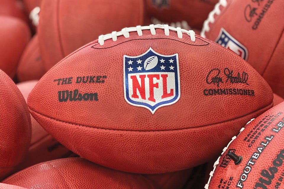 What is the ball played in the NFL made out of?