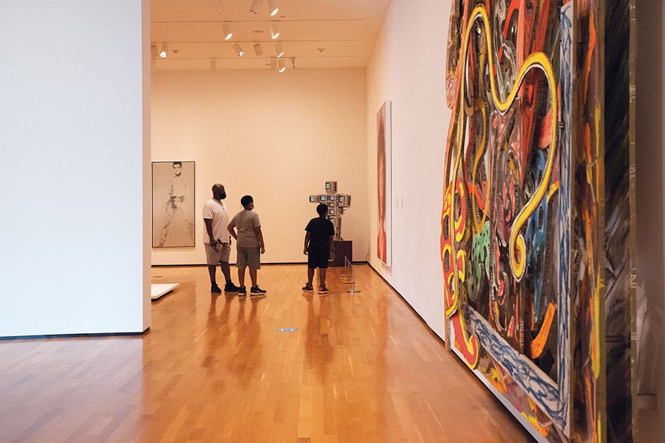 Visitors in a gallery at the Akron Art Museum