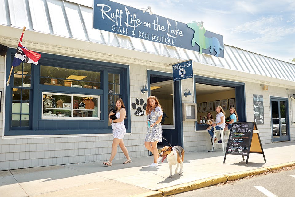 Women walking dogs outside Ruff Life on the Lake Women walking dogs outside Ruff Life on the Lake