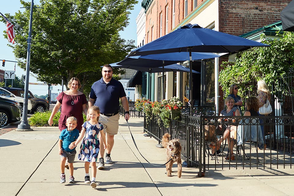 Parents, children and dog walking in downtown Perrysburg (photo by Casey Rearick)