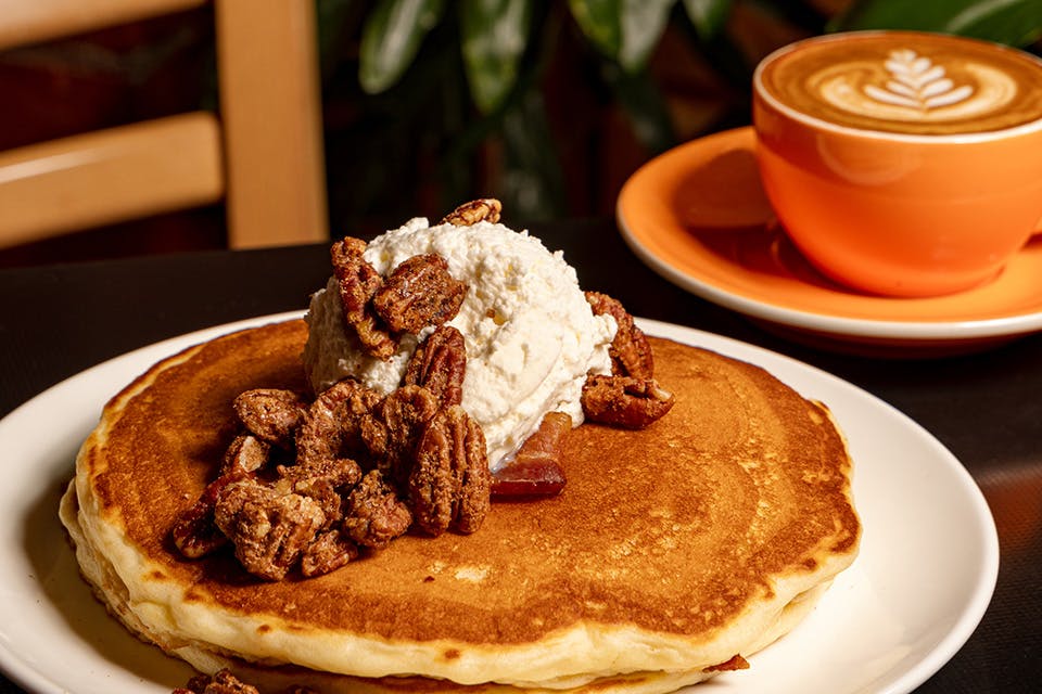 Sleepy Bee’s Cafe Piggy Pancakes and latte (photo by Hailey Bollinger) Sleepy Bee’s Cafe Piggy Pancakes and latte (photo by Hailey Bollinger)