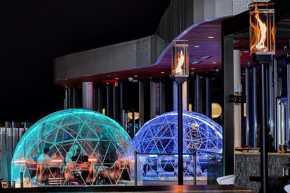 People dining in two colorful igloos at Vaso in Dublin (photo courtesy of Vaso)