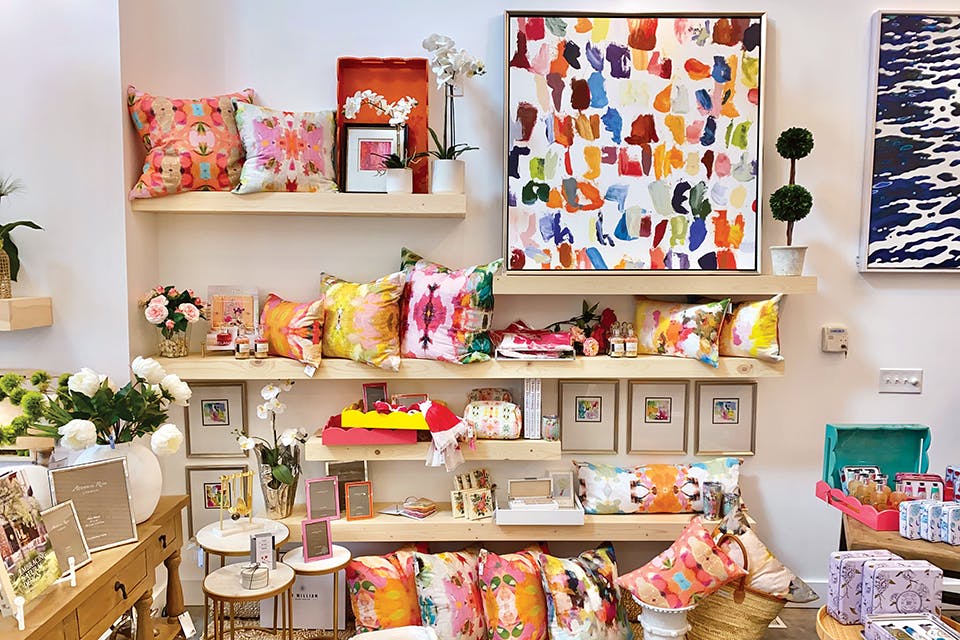 Shelves filled with colorful pillows, paintings and frames at Perrysburg’s Gather by Angel 101 (photo by Shelby Lahey)