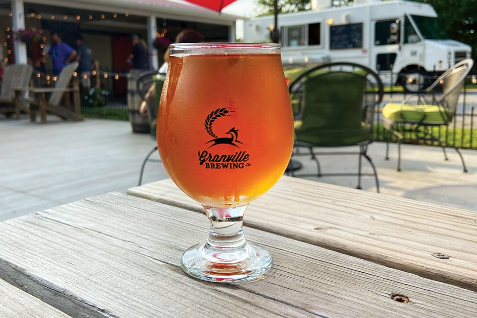 Beer in glass on patio at Granville Brewing Co. (photo courtesy of Granville Brewing Co.)