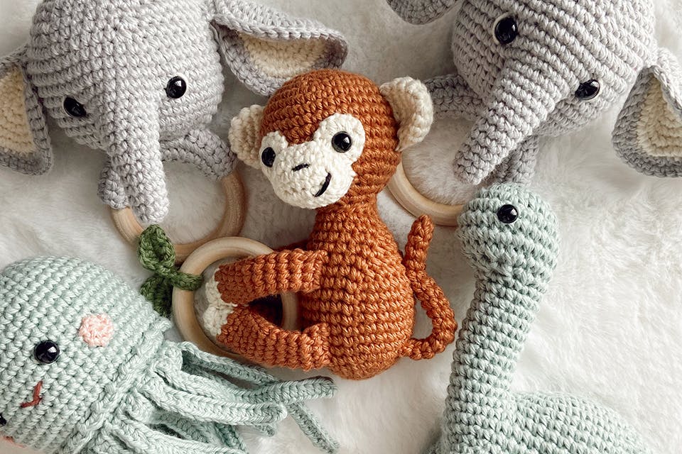 Crocheted monkey, elephant, octopus and dinosaur rattles (photo courtesy of Leah Hurt)