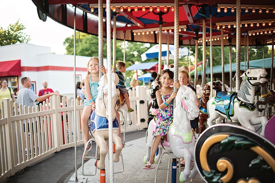 Two girls on the carousel at Memphis Kiddie Park in Cleveland (photo courtesy of Memphis Kiddie Park)