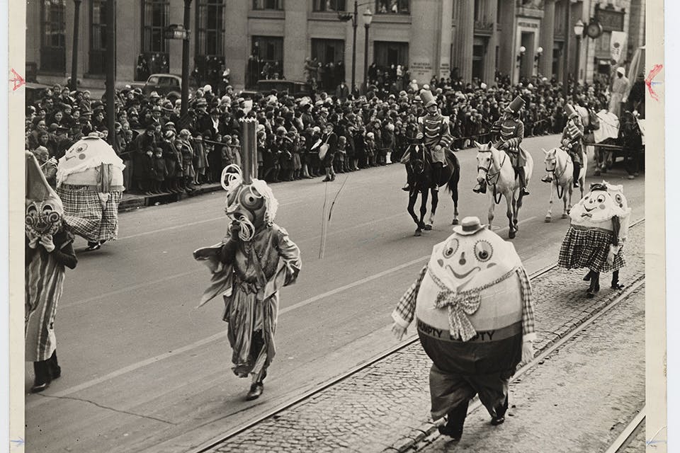 Characters walking down the street at the 1935 Rike’s Toy Parade in downtown Dayton (photo courtesy of Ohio History Connection)