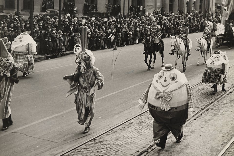 Characters walking down the street at the 1935 Rike’s Toy Parade in downtown Dayton (photo courtesy of Ohio History Connection)