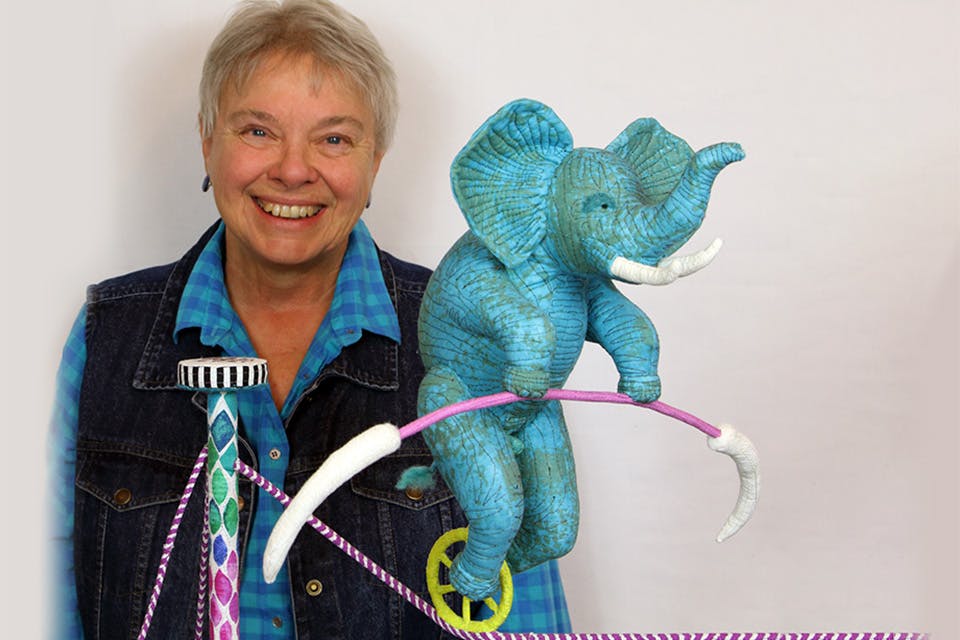 Artist Susan Else with one of her creations from “Without a Net” (photo courtesy of Susan Else)