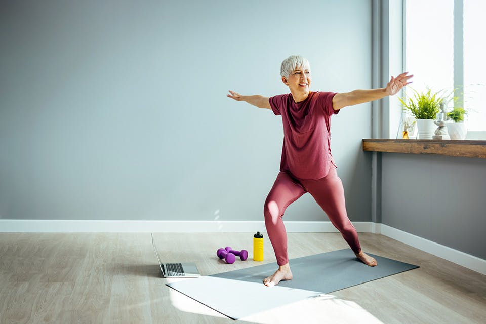 Woman doing indoor yoga (photo by iStock)