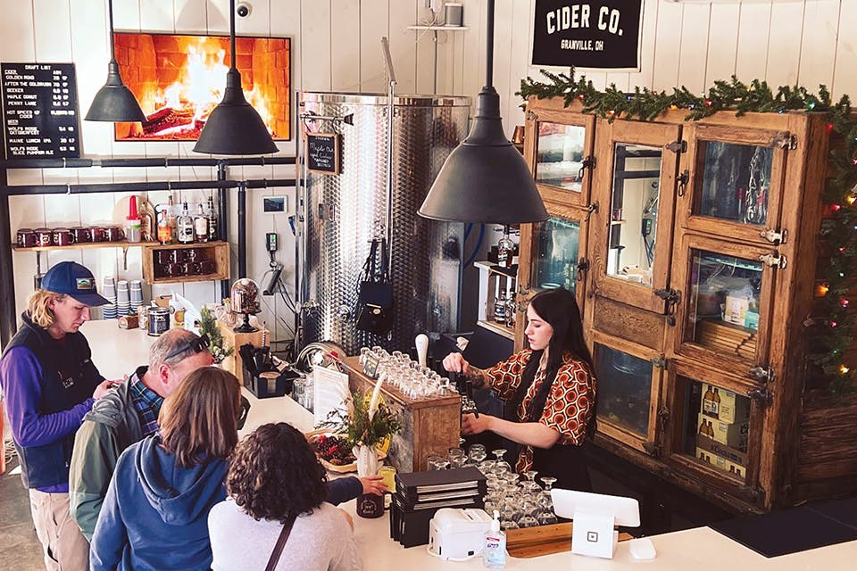 People gathering at bar at Seek No Further Cidery in Granville (photo courtesy of Seek No Futher Cidery)