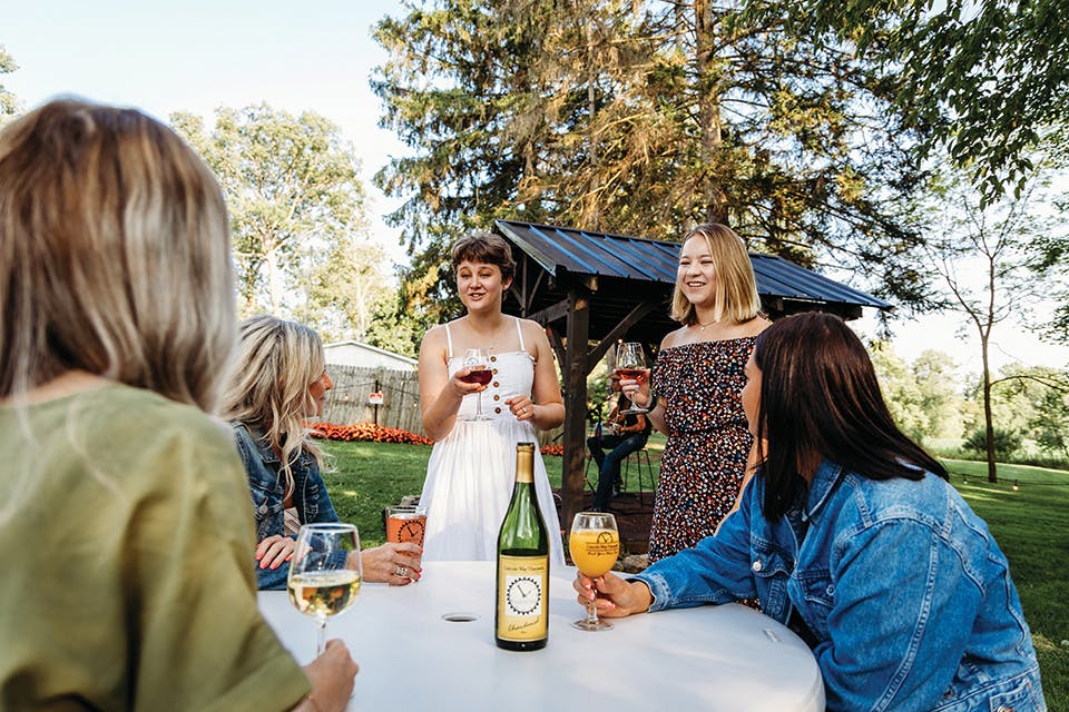 Women talking at Lincoln Way Vineyards in Wooster (photo by Stephanie Park)
