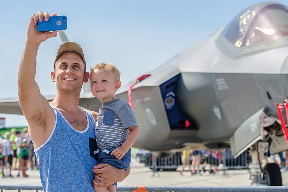 Dad and child at CenterPoint Energy Dayton Air Show (photo courtesy of Dayton Convention & Visitors Bureau)