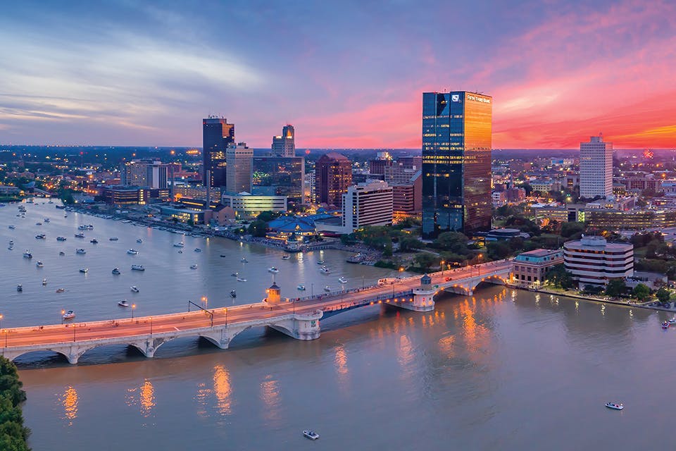 Aeria view of Toledo skyline and boat filled Maumee River at sunset on July 4 (photo by Toledo Aerial Media)