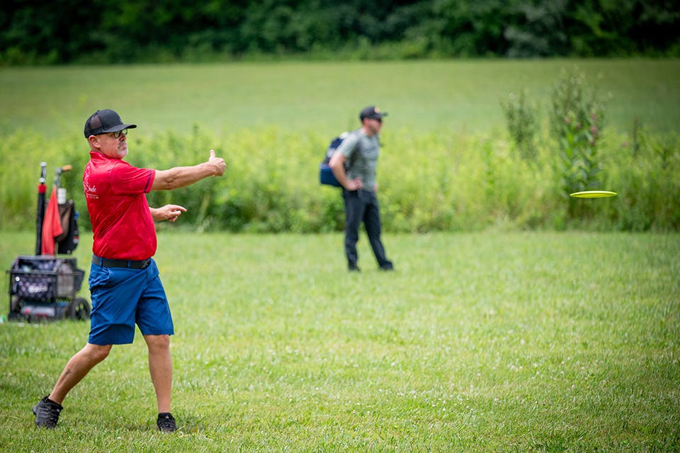 Man throwing disc at Caesar Ford State Park in Xenia (photo courtesy of Greene County Parks & Trails)