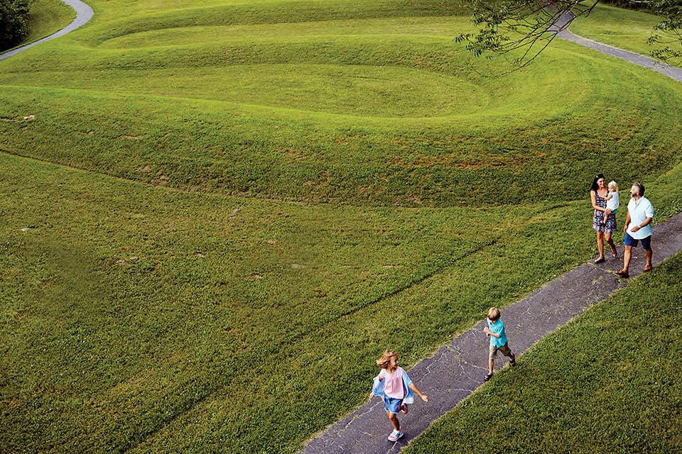 Aerial view of parents and kids walking at Peebles’ Serpent Mound (photo by Casey Rearick)