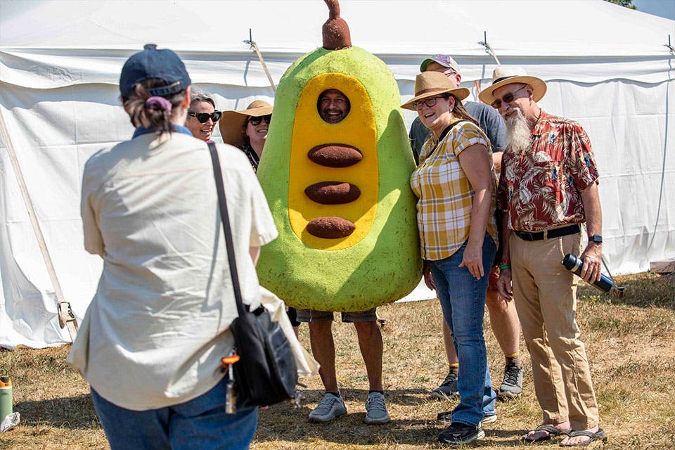 Ohio Pawpaw Festival attendees pose with the event’s mascot (photo courtesy of Ohio Pawpaw Festival)