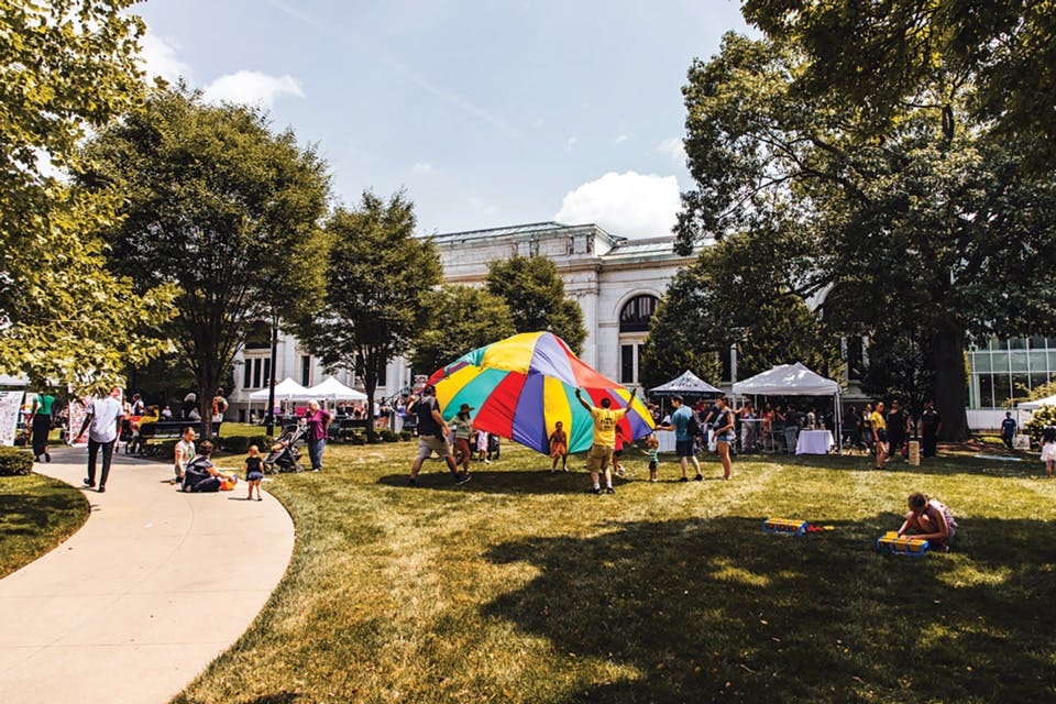 Kids playing with a parachute at the Columbus Book Festival at Topiary Park (photo courtesy of the Columbus Book Festival) Kids playing with a parachute at the Columbus Book Festival at Topiary Park (photo courtesy of the Columbus Book Festival)