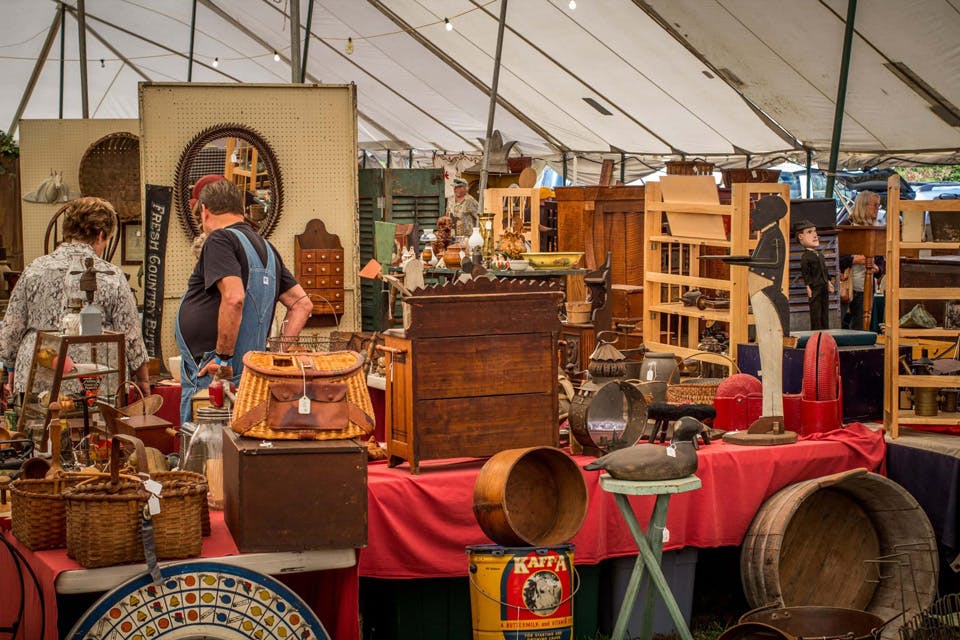 Collection of antiques under vendor tent at Zoar Antiques and Artisans Show (photo courtesy of Historic Zoar Village)