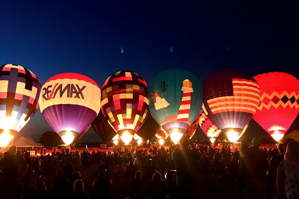 Illuminated hot air balloons lined up at Rossford Balloon & Fireworks Fest (photo courtesy of Rossford Convention & Visitors Bureau)