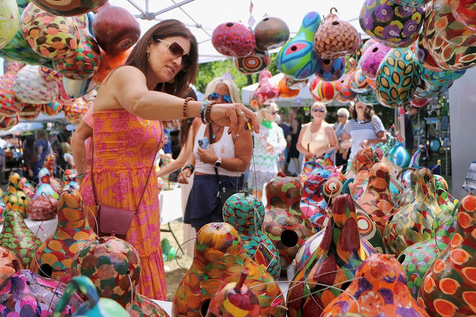 Woman looking at painted gourds at the Willoughby ArtsFest (photo courtesy of Willoughby ArtsFest) Woman looking at painted gourds at the Willoughby ArtsFest (photo courtesy of Willoughby ArtsFest)