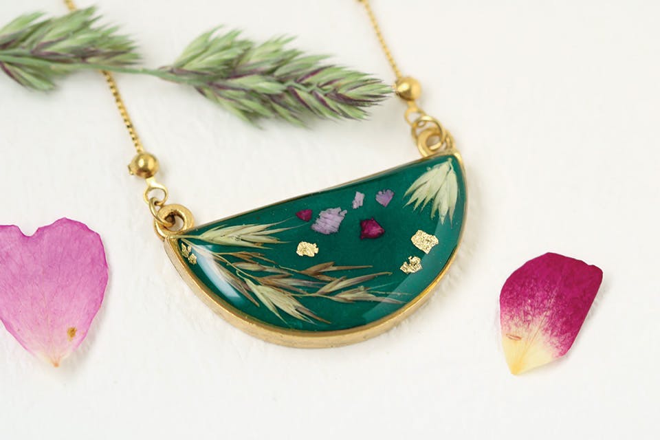 Dark green half moon botanical necklace by Rebecca Noel Designs in Cincinnati (photo courtesy of Rebecca Loomis) Dark green half moon botanical necklace by Rebecca Noel Designs in Cincinnati (photo courtesy of Rebecca Loomis)