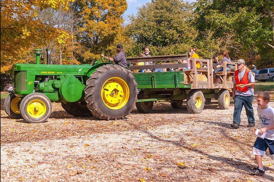 People on hay ride on tractor at Heritage Farms Pumpkin Pandemonium in Peninsula (photo courtesy of Heritage Farms) People on hay ride on tractor at Heritage Farms Pumpkin Pandemonium in Peninsula (photo courtesy of Heritage Farms)