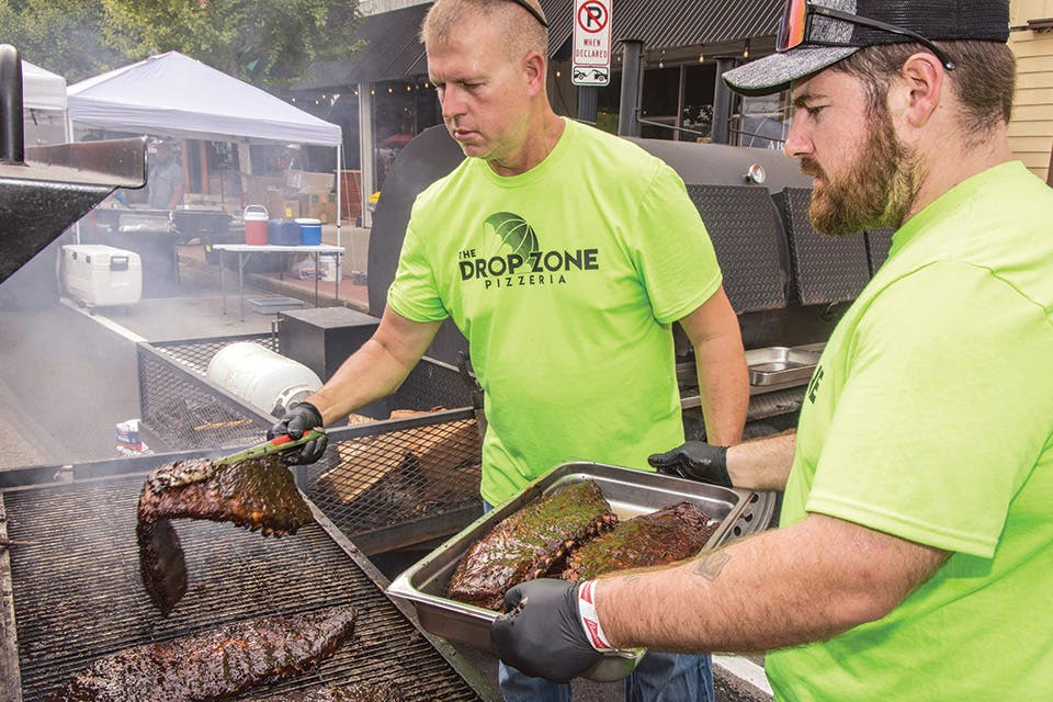 Men working the grill at Defiance Rib Fest in Downtown Defiance (photo courtesy of Visit Defiance Ohio) Men working the grill at Defiance Rib Fest in Downtown Defiance (photo courtesy of Visit Defiance Ohio)