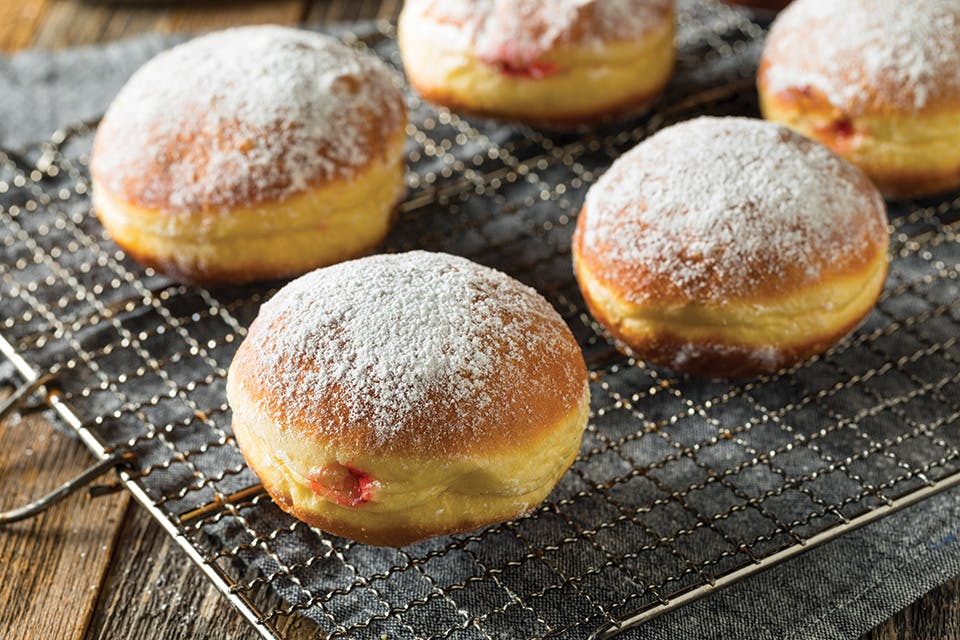 Paczkis on a cooling rack (photo courtesy of iStock)