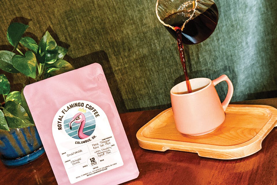 Bag and mug of coffee at Royal Flamingo Coffee in Columbus (photo courtesy of Royal Flamingo Coffee)