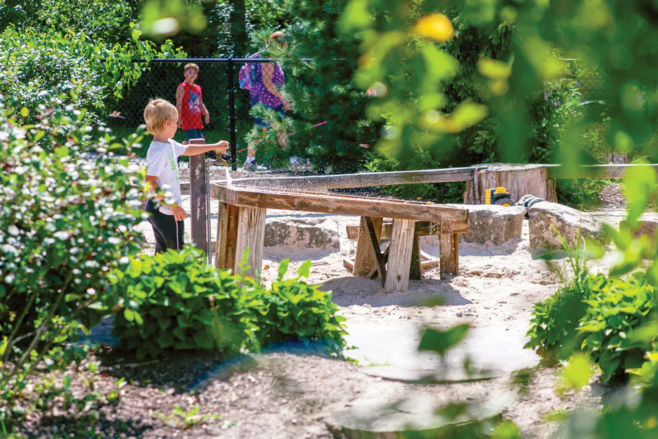 Kid playing at Nature Play at Penitentiary Glen Reservation in Kirtland (photo by CLEWITHKIDS)