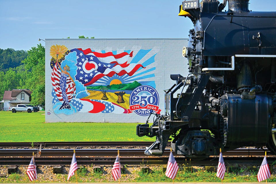 Steam locomotive in front of America 250 Ohio mural during America 250 Ohio Transportation Celebration (photo courtesy of Tuscarawas County Convention & Visitors Bureau)