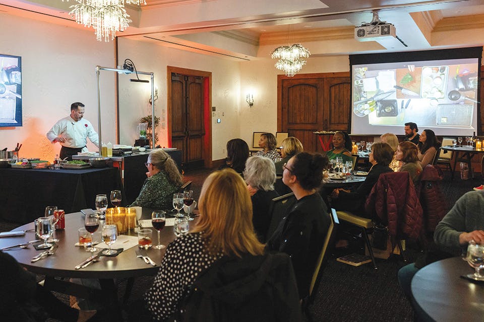 Visitors watching a cooking demonstration at Cucina Demonstration Dinner (photo courtesy of Gervasi Vineyard Resort & Spa)