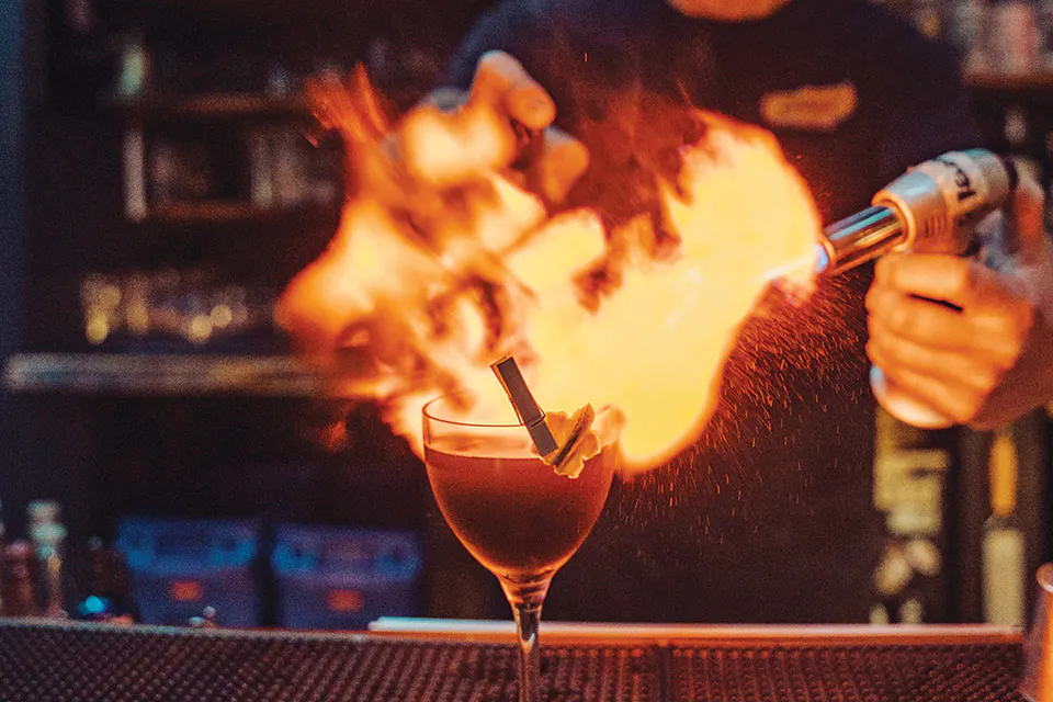 Wolf Moon cocktail on fire at LBM in Lakewood (photo by Natalie Renee Photos)